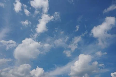 White fluffy clouds in the sky. Blue sky and cloud cover on a sunny summer da 写真素材