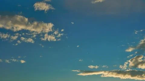 White fluffy clouds in the sky. Blue sky and cloud cover on a sunny summer da 写真素材