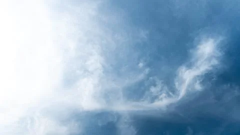 White fluffy clouds in the sky. Blue sky and cloud cover on a sunny summer da 写真素材