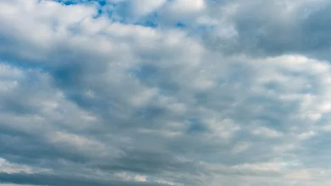 White fluffy clouds in the sky. Blue sky and cloud cover on a sunny summer da 写真素材