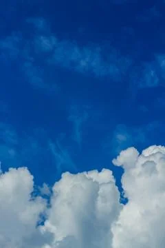 White fluffy clouds in the sky Stock Photos