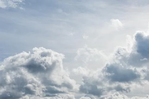 White fluffy clouds in the sky Stock Photos