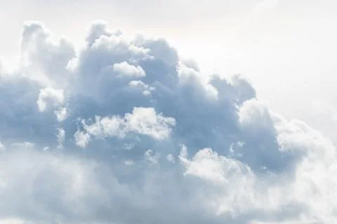 White fluffy clouds in the sky Stock Photos