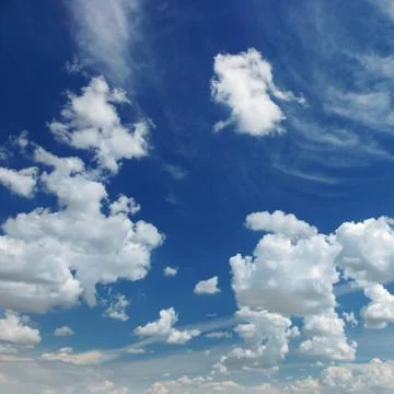 White fluffy clouds on sky Fotos Stock