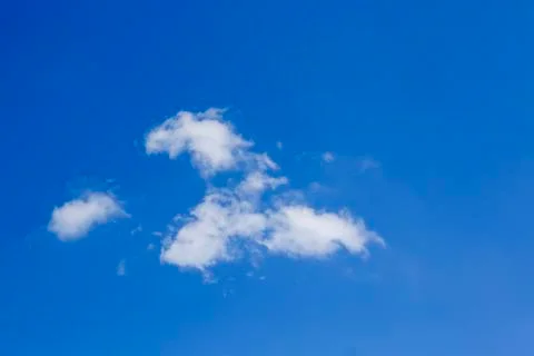 White fluffy clouds in the sky. Stock Photos