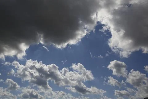 White fluffy clouds in the sky. Stock Photos