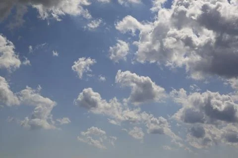 White fluffy clouds in the sky. Stock Photos