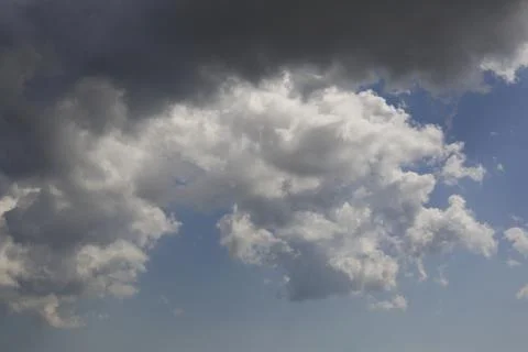 White fluffy clouds in the sky. Stock Photos