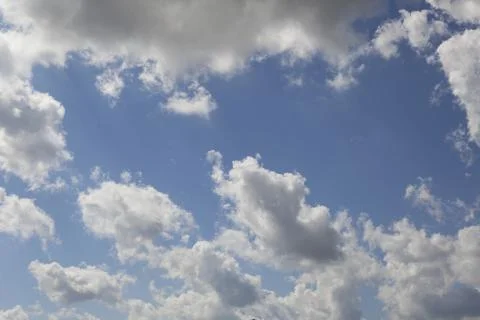 White fluffy clouds in the sky. Stock Photos
