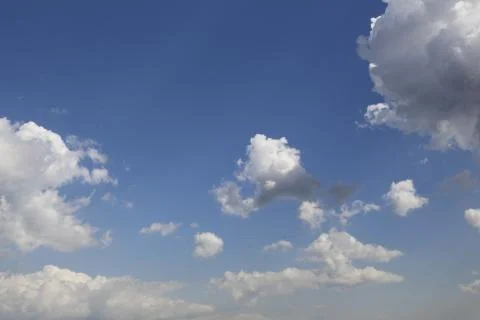White fluffy clouds in the sky. Stock Photos