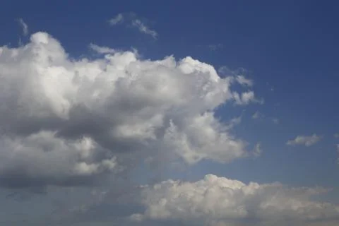 White fluffy clouds in the sky. Stock Photos