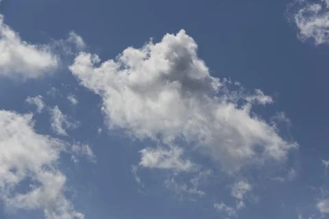 White fluffy clouds in the sky. Stock Photos