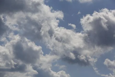 White fluffy clouds in the sky. Stock Photos