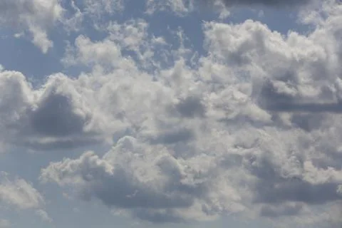 White fluffy clouds in the sky. Stock Photos