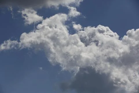 White fluffy clouds in the sky. Фото
