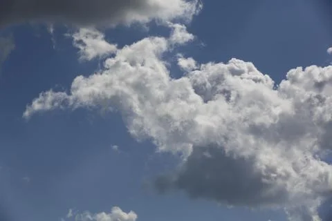 White fluffy clouds in the sky. 스톡 사진