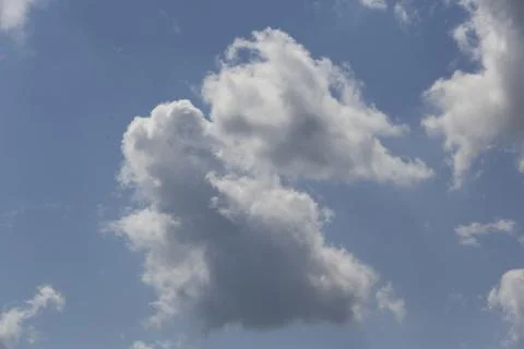 White fluffy clouds in the sky. Stock Photos