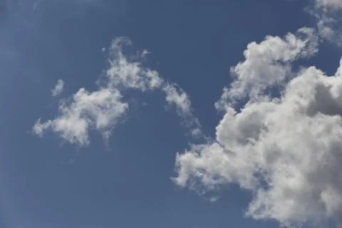 White fluffy clouds in the sky. Stock Photos