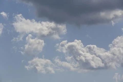 White fluffy clouds in the sky. Stock Photos