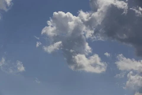 White fluffy clouds in the sky. Stock Photos