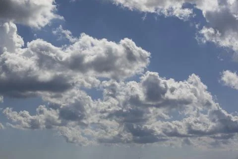 White fluffy clouds in the sky. Stock Photos