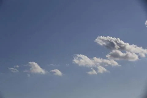 White fluffy clouds in the sky. Stock Photos