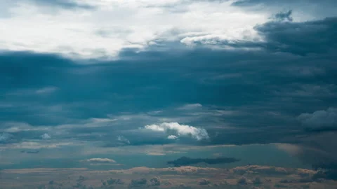 White Fluffy Clouds Slowly Float Through the Blue Daytime Sky Timelapse Video stock 199601178