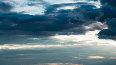 White Fluffy Clouds Slowly Float Through the Blue Daytime Sky Timelapse Stock Footage 200133763