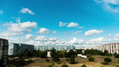 White Fluffy Clouds Slowly Float Through the Blue Daytime Sky Timelapse Stock Footage 201238597
