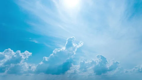 White Fluffy Clouds Slowly Float Through the Blue Daytime Sky Timelapse Stock Footage 209365981
