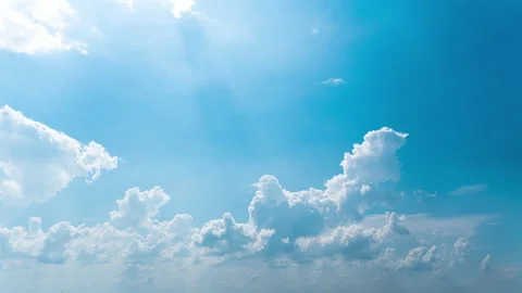 White Fluffy Clouds Slowly Float Through the Blue Daytime Sky Timelapse Stock Footage 209370615