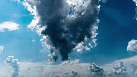 White Fluffy Clouds Slowly Float Through the Blue Daytime Sky Timelapse Stock Footage 244204580
