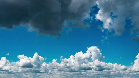 White Fluffy Clouds Slowly Float Through the Blue Daytime Sky Timelapse Stock Footage 248306129
