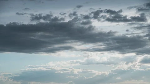White Fluffy Clouds Slowly Float Through the Blue Daytime Sky Timelapse Stock Footage 271228333