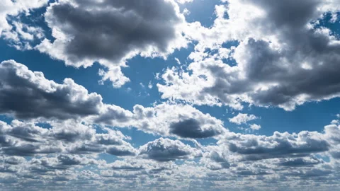 White Fluffy Clouds Slowly Float Through the Blue Daytime Sky Timelapse Video stock 271230269