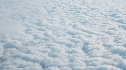 White fluffy clouds texture view from above during flight at high altitude Stock Footage 325118139