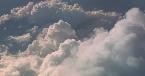 White fluffy clouds top view, sunny day. Huge mountains of cotton clouds view Stock Footage