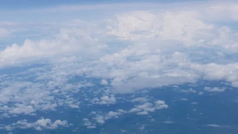 White fluffy clouds view from the window of an aircraft. Aerial view, flyin.. Video stock 243407846