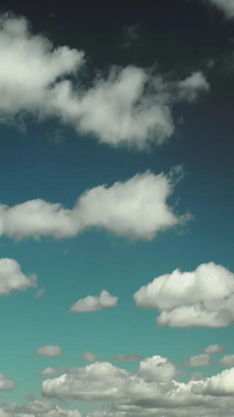 White Fluffy Cumulus Clouds in Teal Blue Sky Timelapse Video stock 341166127