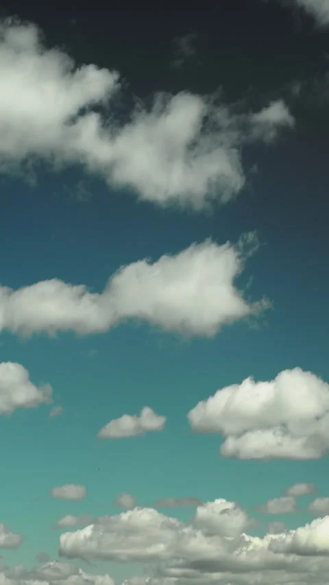 White Fluffy Cumulus Clouds in Teal Blue Sky Timelapse Video stock 341366577