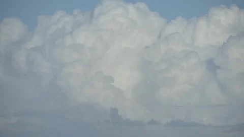 White fluffy floating clouds moving and mixing in wind Stock Footage 277686314