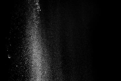 White fluffy snow on small particles isolated on black background Stock Photos