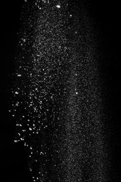 White fluffy snow on small particles isolated on black background Stock Photos