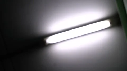 The white fluorescent light is constantly flashing on and off. above the ceiling Video stock 161720559