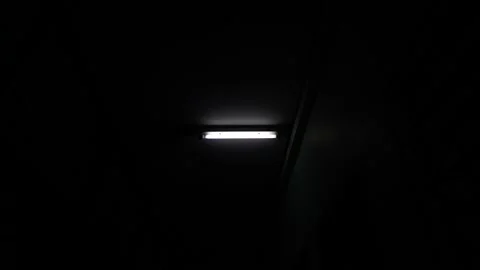 White fluorescent lighting flickers on and off and one bulb in the building or h Video stock 162111736