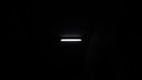 White fluorescent lighting flickers on and off and one bulb in the building or h Video stock 162111780