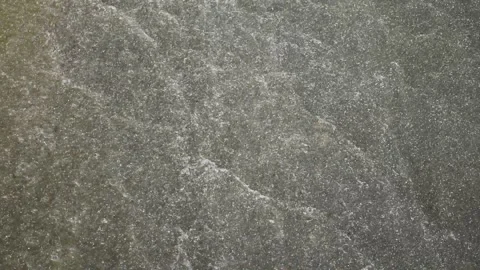 White foam and waves in the water flowing on gray concrete floor at the dam Stock Footage 132019743