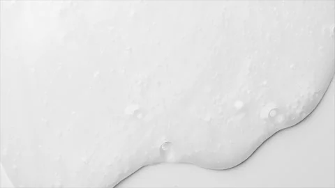 White Foam bubbles background. Moving Soap foam popping bubble, white backdrop Video stock 316246033