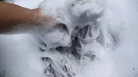 White foam bubbles from cloth laundry Stock Footage 273247440