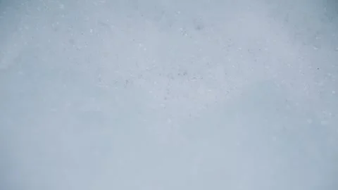 White Foam Bubbles Moving Gently on Water Surface Stock Footage 313573074